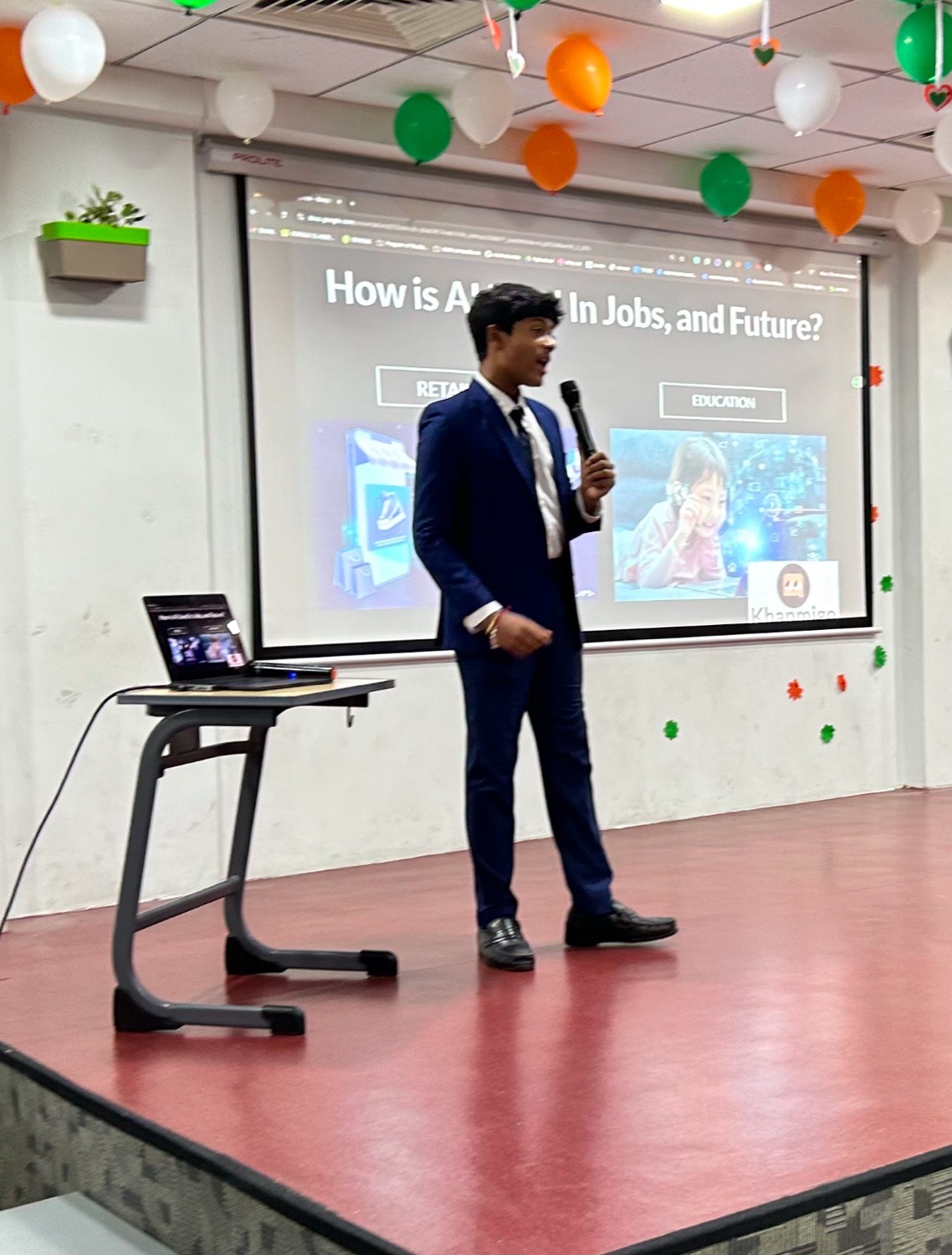 Shashank holding a microphone beside a slide reading how is AI used in jobs, and future